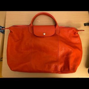 - Longchamp.  Le Pliage Cuir Leather CrossBody Bag